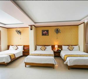 Postel nebo postele na pokoji v ubytování Hotel Đại An An