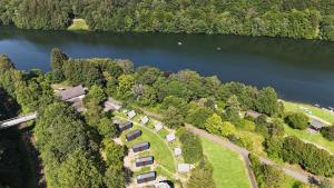 an aerial view of a resort on the shore of a lake at Bigge Elements Tinyhaus 1 "Erde" in Olpe