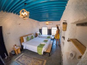 Postel nebo postele na pokoji v ubytování SAMA Wakan Heritage Homes