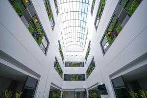 an internal view of a building with plants at Snood Al Narjis Hotel in Riyadh