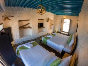 Postel nebo postele na pokoji v ubytování SAMA Wakan Heritage Homes + 28 fotografií