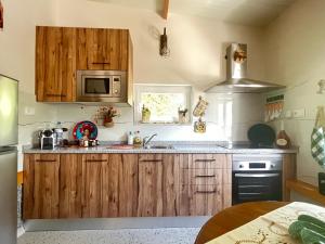 Kuchyň nebo kuchyňský kout v ubytování Estúdio acolhedor centro Vila Real