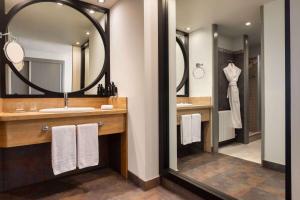 a bathroom with a sink and a mirror at Dolce by Wyndham Barcelona Resort in Sant Esteve Sesrovires +86 photos
