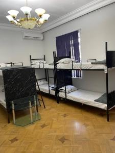 Postel nebo postele na pokoji v ubytování Olympic Hostel