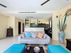 a living room with a couch and a table at villa lavanya in Bophut 
