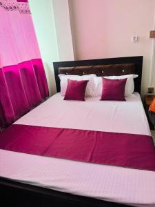 Katil atau katil-katil dalam bilik di Hotel Pema