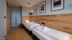 A bed or beds in a room at Bukowa 21, Sun & Snow