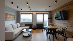 A television and/or entertainment centre at Bukowa 21, Sun & Snow