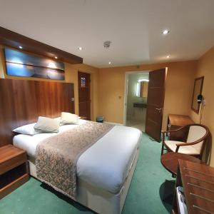 Postel nebo postele na pokoji v ubytování Oliver Hotel