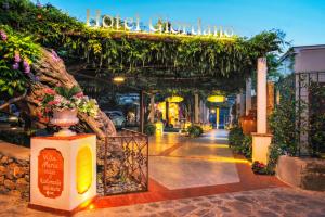 a walkway with a sign that reads hotel showroom at Hotel Giordano in Ravello