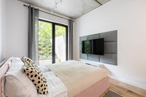 Postel nebo postele na pokoji v ubytování Homewell Apartments Lofty nad Wartą