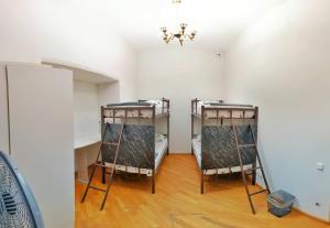 Voodi või voodid majutusasutuse Olympic Hostel toas
