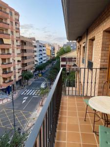 a balcony with a view of a city street at Apartamento Marisol in Alcañiz