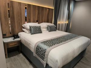 Voodi või voodid majutusasutuse فندق نسمات مكةNasamat Makkah Hotel toas