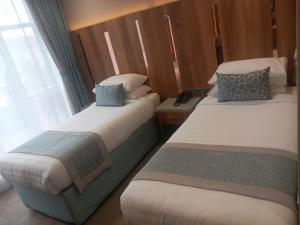 Voodi või voodid majutusasutuse فندق نسمات مكةNasamat Makkah Hotel toas