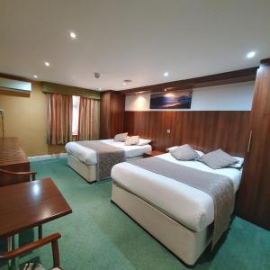 Postel nebo postele na pokoji v ubytování Oliver Hotel