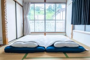 Postel nebo postele na pokoji v ubytování Suwa tiny house 一棟まるまる貸切 limited to 1group per day