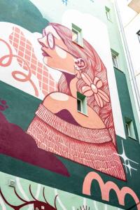 a mural of a woman on the side of a building at Upon Angels - Adults Only in Lisbon