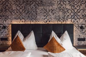 Postel nebo postele na pokoji v ubytování Hotel - Gasthof Märzenklamm