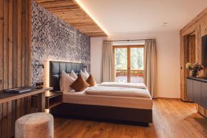 Postel nebo postele na pokoji v ubytování Hotel - Gasthof Märzenklamm