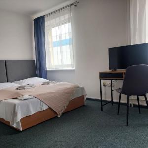 Postel nebo postele na pokoji v ubytování Garni G Hotel Žilina
