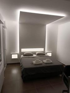 Postel nebo postele na pokoji v ubytování CIVICO 14 Holiday Rooms