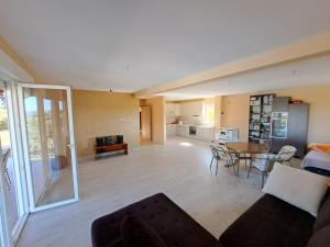 a living room with a couch and a table at Villa Sunset in Banja Luka