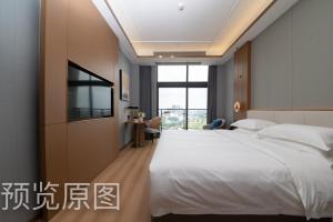 Postel nebo postele na pokoji v ubytování Poltton Foshan Sanshui Century Hotel