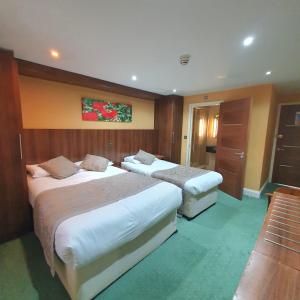 Postel nebo postele na pokoji v ubytování Oliver Hotel