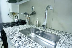 Dapur atau dapur kecil di Departamento en Trelew - céntrico y moderno +16 gambar