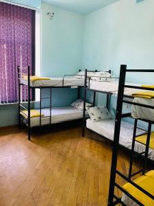 Voodi või voodid majutusasutuse Olympic Hostel toas