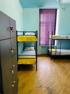 Voodi või voodid majutusasutuse Olympic Hostel toas