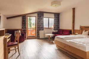 Postel nebo postele na pokoji v ubytování Hotel - Gasthof Märzenklamm