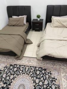 Postel nebo postele na pokoji v ubytování Che Wan's Homestay