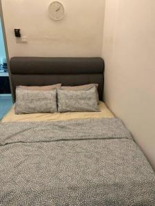 Postel nebo postele na pokoji v ubytování Che Wan's Homestay