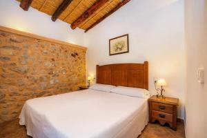 Postel nebo postele na pokoji v ubytování Agroturismo s'Hort de sa Bagura + 188 fotografií