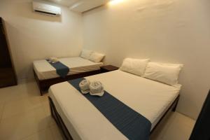 Voodi või voodid majutusasutuse Samba Bluewater Resort toas
