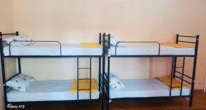 Voodi või voodid majutusasutuse Olympic Hostel toas