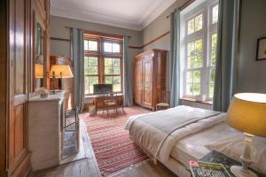Postel nebo postele na pokoji v ubytování Manoir de la Dune
