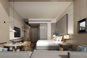 Postel nebo postele na pokoji v ubytování Courtyard by Marriott Luoyang