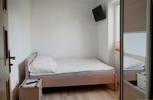 Posteľ alebo postele v izbe v ubytovaní Rega pokoje