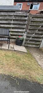 a bench and a potted plant in front of a set of stairs at Motorhome in Hinckley- Sleeps 3- Pet Friendly in Hinckley