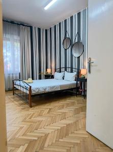 a bedroom with a bed in a room at Belle Vue Ultracentral Apartments in Timişoara