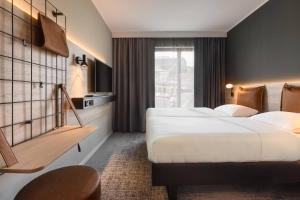 Letto o letti in una camera di Moxy Dresden Neustadt