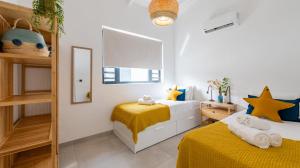 Voodi või voodid majutusasutuse Penthouse Mesa Bonita toas
