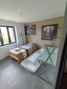 Postel nebo postele na pokoji v ubytování La colloc rue des bulles