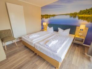 Ένα ή περισσότερα κρεβάτια σε δωμάτιο στο Apartment am See - 11