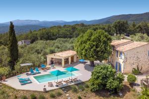 an aerial view of a villa with a swimming pool at Villa La Bergerie by Villa Plus in Saint-Cézaire-sur-Siagne