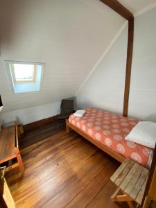 Postel nebo postele na pokoji v ubytování Hostal Compass del Sur