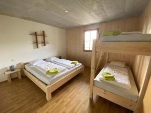 A bed or beds in a room at Familyparadies GAMPLALM